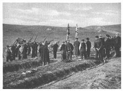 County volunteers of Islay firing a volley at the funeral
of Tuscania victims at Kilnaughton, to the accompaniment of bagpipe
lament
(Times Photo Service)