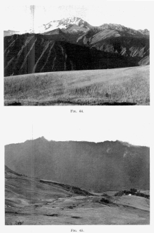 Fig. 44&mdash;The snow-capped Cordillera Vilcapampa north of
Yucay and the upper canyon of the Urubamba from the wheat fields near
Chinchero. In the foreground is one of the well-graded mature slopes of
Fig. 123. The crests of the mountains lie along the axis of a granite
intrusion. The extent of the snowfields is extraordinary in view of the
low latitude, 13° S.