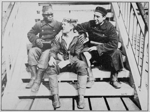 “ALLIES.” TWO BELGIAN SOLDIERS, ONE BEING FROM THE CONGO,
HAVING A CHAT WITH A JACK TAR ON THE QUAY AT OSTEND.

Photo by International News Service.
