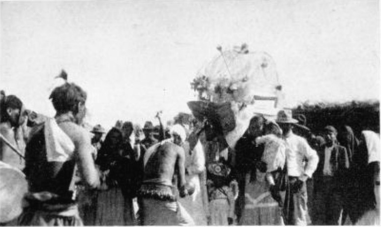 THE CHRIST WAS REPRESENTED BY A CHEAP RAG DOLL CRADLED IN
A WICKER BASKET